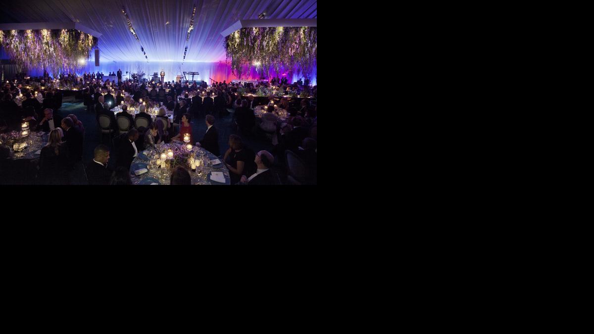 
In this Feb. 11, 2014, file photo, President Barack Obama, center, offers a toast on stage to French President Francois Hollande at the State Dinner on the South Lawn of the White House in Washington. Obama has held the fewest number of state dinners since Harry S. Truman, who left office 62 years ago. In his first six years, Obama held just seven state dinners. He’ll hold at least two more this year, for the leaders of Japan, on April 28, 2015 and China, later in the year. 
