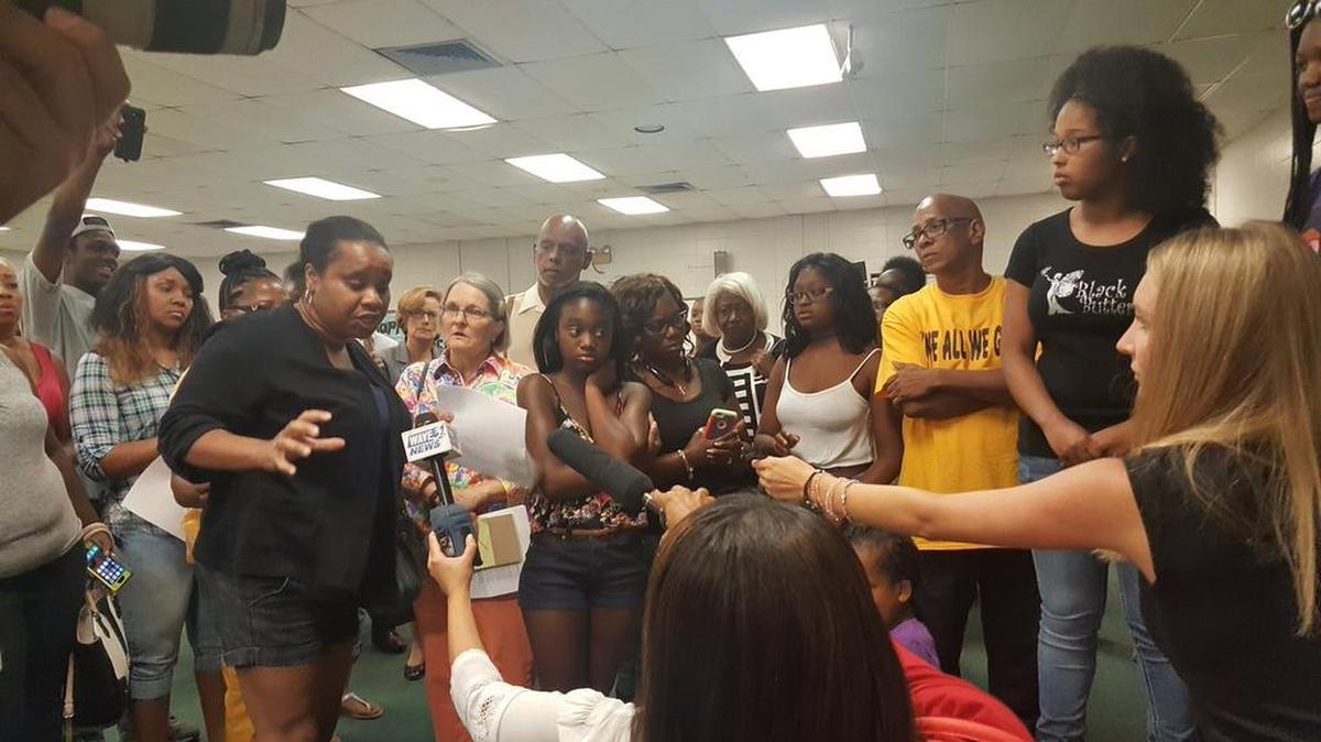 Many black women attended Butler Traditional High School’s meeting on the dress code policy Friday afternoon. The portion of the policy on hair was widely criticized as racist, because it named styles mostly worn by black people.