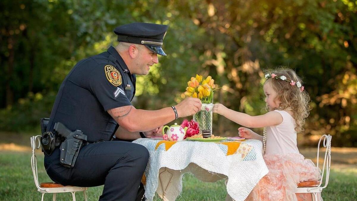 Officer Patrick Ray accepted young Bexley’s invitation for a tea party a year after he saved her life.