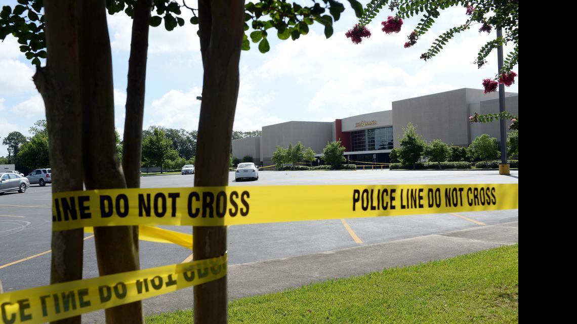 
Police tape remains around the Grand 16 movie theater in Lafayette, La., on Friday, July 24, 2015, after a shooting Thursday night left three people dead, including the shooter, and nine injured. The quick reactions of two teachers in the movie theater audience – Ali Viator Martin and Jena Legnon Meaux – are credited with saving lives. 
