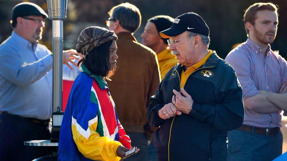 University of Missouri Chancellor R. Bowen Loftin, second from right, spoke with people Sunday at the location where student protesters had put up tents on the campus as part of an effort to oust system president Tim Wolfe.