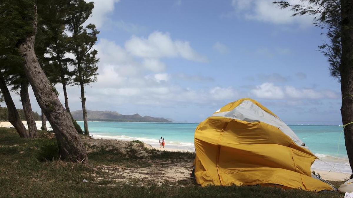 A tent sits on Waimanalo Beach, one of the state’s world-class beaches, in Waimanalo, Hawaii on Thursday. A bill is being considered by Hawaii lawmakers to crack down on vacation rental brokers who offer tents to tourists on the islands beaches and public parks.