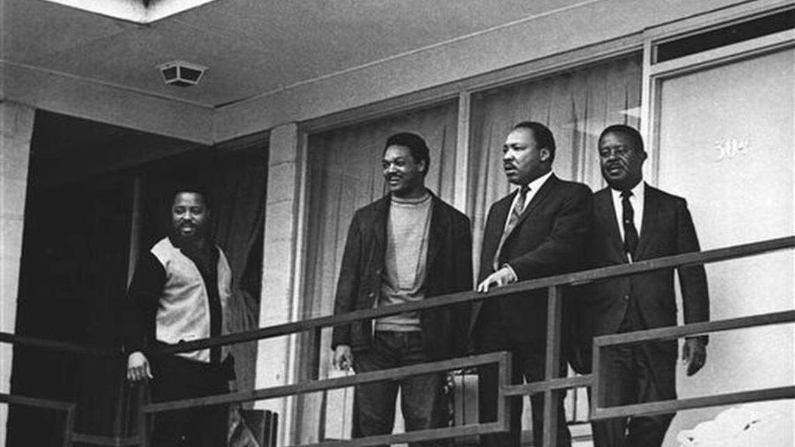 FILE - In this April 3, 1968 file photo, the Rev. Martin Luther King Jr. stands with other civil rights leaders on the balcony of the Lorraine Motel in Memphis, Tenn., a day before he was assassinated at approximately the same place. From left are Hosea Williams, Jesse Jackson, King, and Ralph Abernathy. King is one of America's most famous victims of gun violence. Just as guns were a complicated issue for King in his lifetime, they loom large over the 30th anniversary of the holiday honoring his birthday.