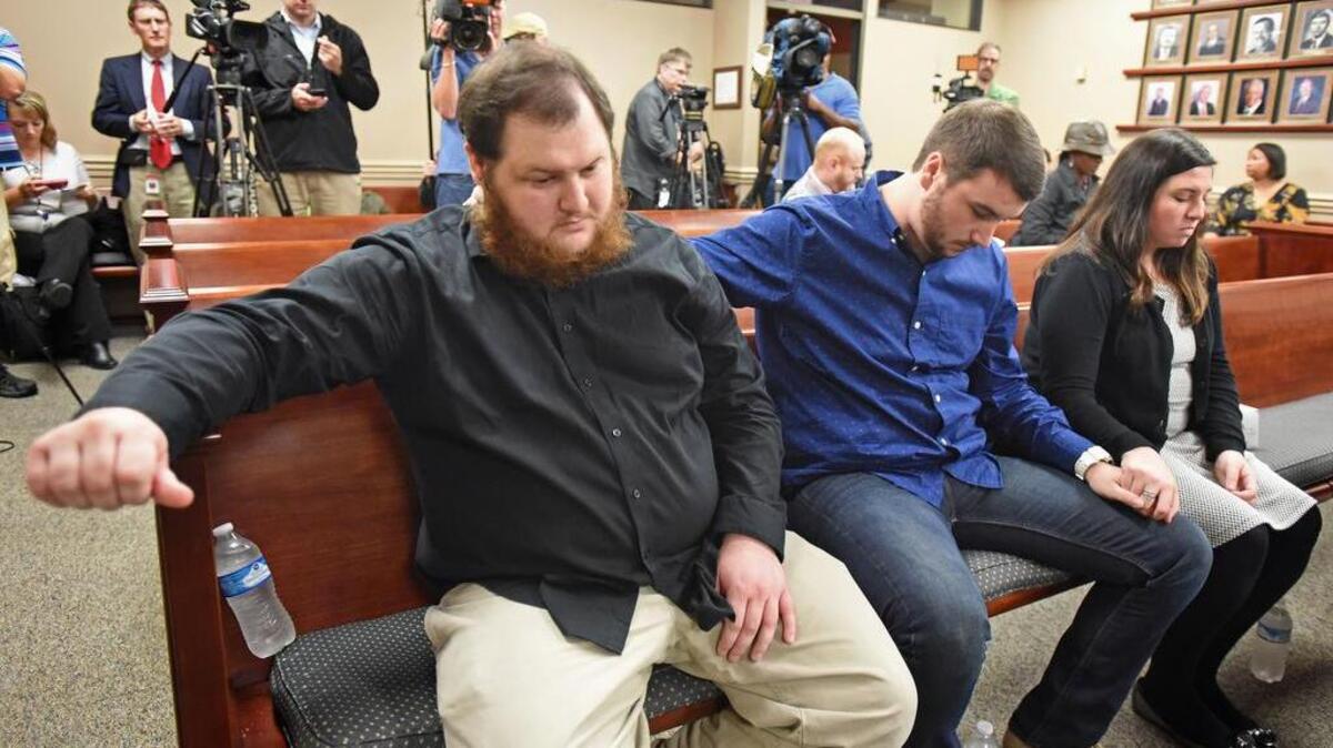 
 Children of Kelly Gissendaner, from left, Brandon Brookshire, Dakota Brookshire and Kayla Gissendaner wait before a hearing to ask parole board to reconsider Gissendaner's clemency request at The State Board of Pardons and Paroles, Sept. 29, 2015., in Decatur, Ga. 
