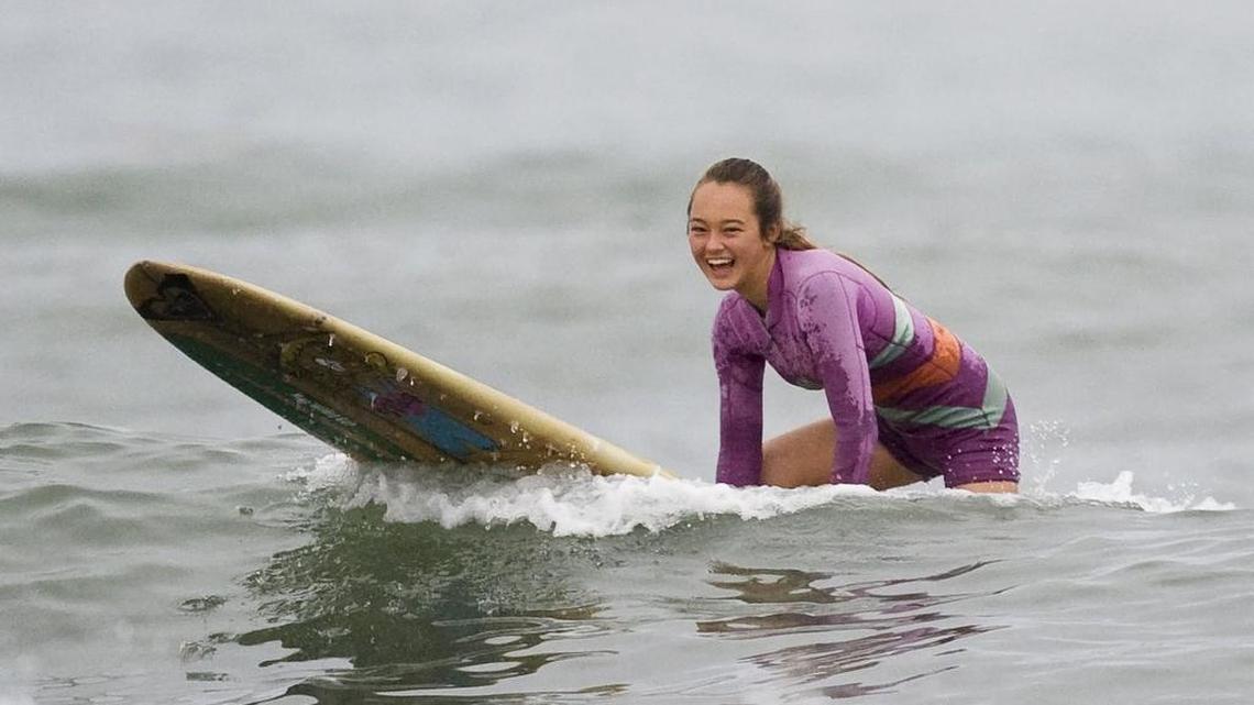In this Friday, May 31, 2013, photo, Meg Roh, 14, of Dana Point, surfs at San Onofre State Beach in San Clemente, Calif. She’s surfed every day for more than 2,000 days.