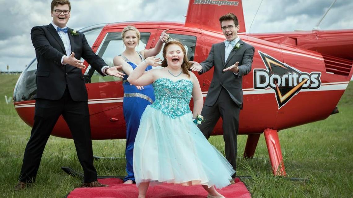 Shaedon Wedel (from right), Carlie Wittman, Taylor Stevenson and Carson Wittman prepare to make a one-of-a-kind entrance to their high school prom on Saturday in Newton, Kan.
