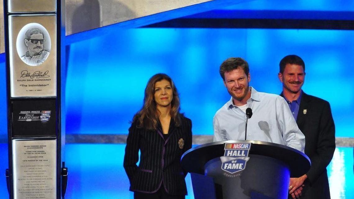 Dale Earnhardt Jr. (center) speaks at his father’s NASCAR Hall of Fame induction in 2010. Earnhardt Jr. told The Observer Thursday he is siding with his half-brother Kerry Earnhardt (right) over his stepmother Teresa Earnhardt (left) in a legal dispute concerning whether Kerry Earnhardt can use his last name on a line of houses he and his wife have designed. Teresa Earnhardt is trying to stop him from doing so in court.