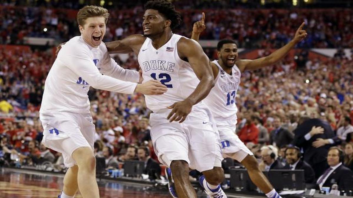 
Duke players celebrate after the NCAA Final Four college basketball tournament championship game Monday, April 6, 2015, in Indianapolis. Duke won 68-63. 

