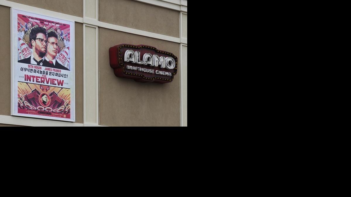 
A large poster advertising the movie The Interview hangs on the back wall of the Alamo Drafthouse Cinema Tuesday, Dec. 23, 2014, in Houston. 
