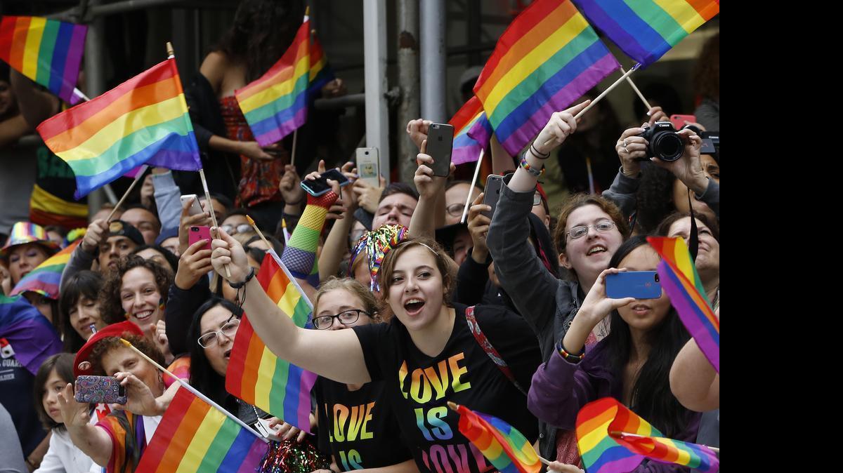 
A crowd waves rainbow flags during the Heritage Pride March in New York on Sunday, June 28, 2015. Large turnouts were expected for gay pride parades across the U.S. following the landmark Supreme Court ruling that said gay couples can marry anywhere in the country.
