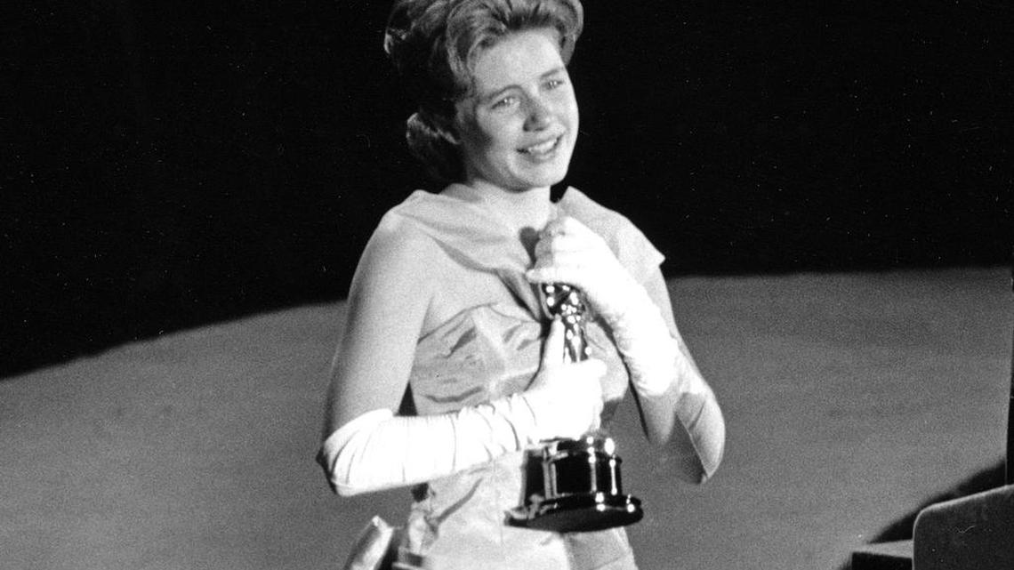 Actress Patty Duke, 16, accepts the Oscar as best supporting actress for her work in “The Miracle Worker” at the 1963 Academy Awards in Santa Monica, Calif. Duke, who won an Oscar as a child at the start of an acting career that continued through her adulthood, died Tuesday, March 29, 2016, of sepsis from a ruptured intestine. She was 69.