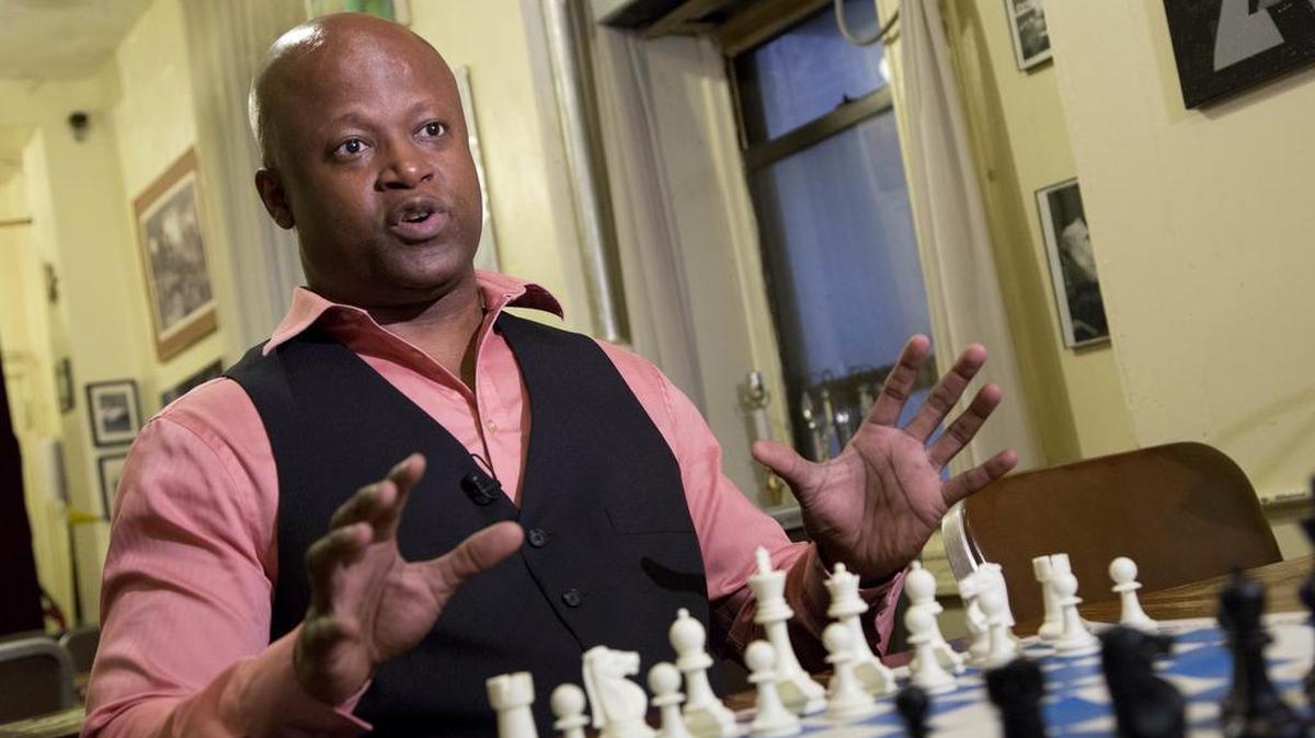 Chess grandmaster Maurice Ashley talks during an interview at Chess Forum in New York on Tuesday, April 12, 2016. The Brooklyn resident has been inducted to the World Chess Hall of Fame in St. Louis.