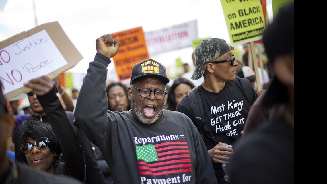 
Demonstrators march to City Hall in Baltimore on Saturday, May 2, 2015, the day after charges were announced against the six police officers involved in Freddie Gray's death.
