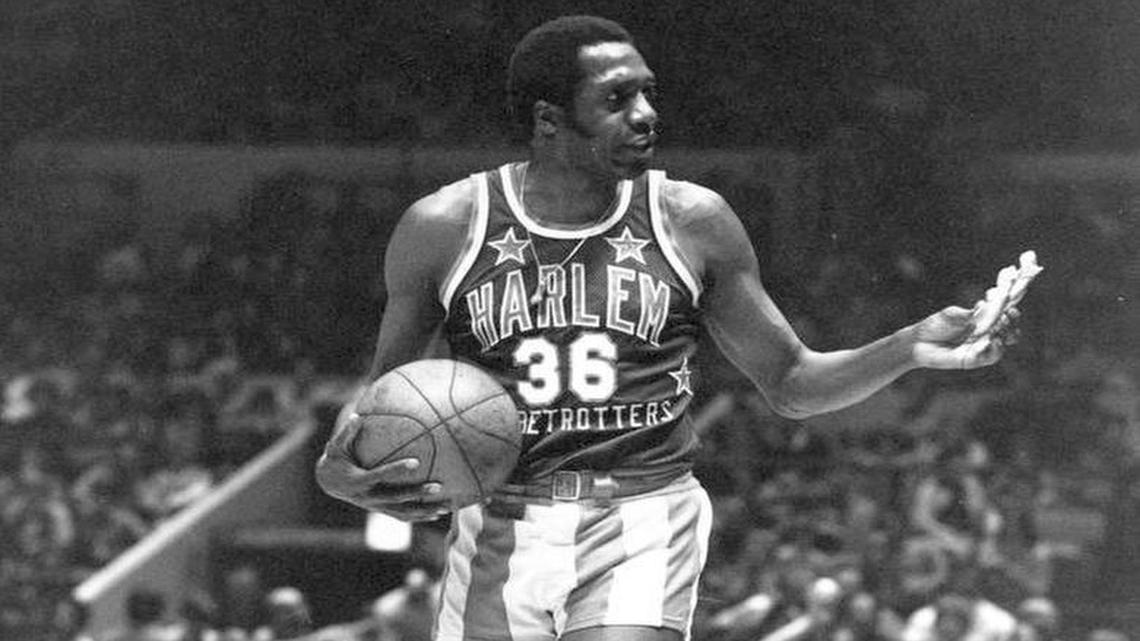 Meadowlark Lemon (36), of the Harlem Globetrotters basketball team, offers a pretzel to a referee during a game at New York's Madison Square Garden, Sunday, Feb. 18, 1978.