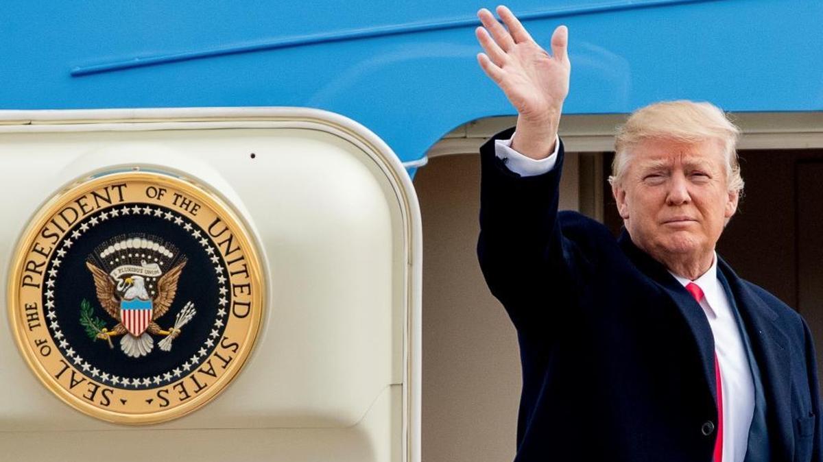 President Donald Trump waves before boarding Air Force One at Andrews Air Force Base in Maryland on Friday, Feb. 17, 2017.