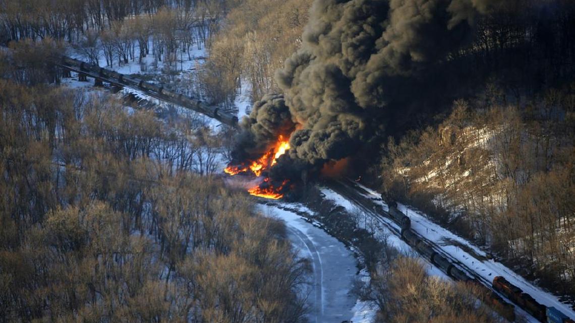 
Oil burns at the site of a March 5, 2015, train derailment near Galena, Ill. A bill in Congress would require railroads to have comprehensive oil spill response plans, but it would also give the secretary of transportation the ability to exempt the details from disclosure.
