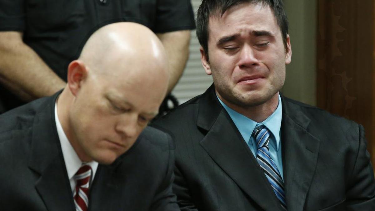 Daniel Holtzclaw, right, cries as the verdicts are read in his trial in Oklahoma City on Dec. 10. At left is defense attorney Robert Gray. A jury found former Oklahoma City police officer Holtzclaw guilty of raping and sexually victimizing eight women on his police beat.
