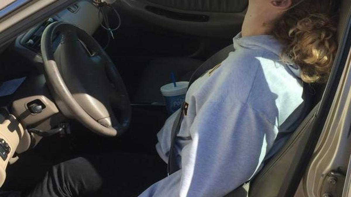 Police say this woman was found unconscious with a needle still in her hand in a parked vehicle while her 10-month-old son cried in the backseat.