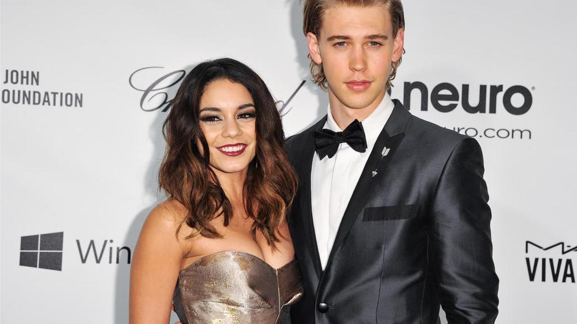 Vanessa Hudgens, left, and Austin Butler, are shown in 2014. Hudgens has paid $1,000 in restitution for carving a heart into a red rock wall with the names Vanessa and Austin. She posted a photo of it on her Instagram page around Valentine’s Day, which gained attention that led to her being cited for damaging a natural feature on U.S. Forest Service land.