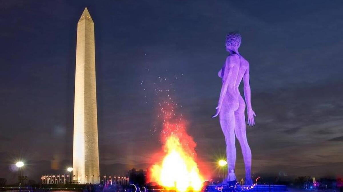 The statue, “R-Evolution” by Marco Cochrane, depicts singer and dancer Deja Solis with short, dark hair.