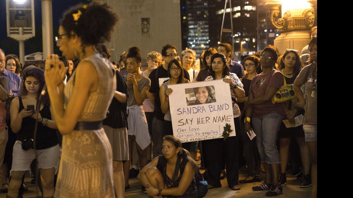 
Protestors watch Page May speak during a vigil for Sandra Bland Tuesday in Chicago. 
