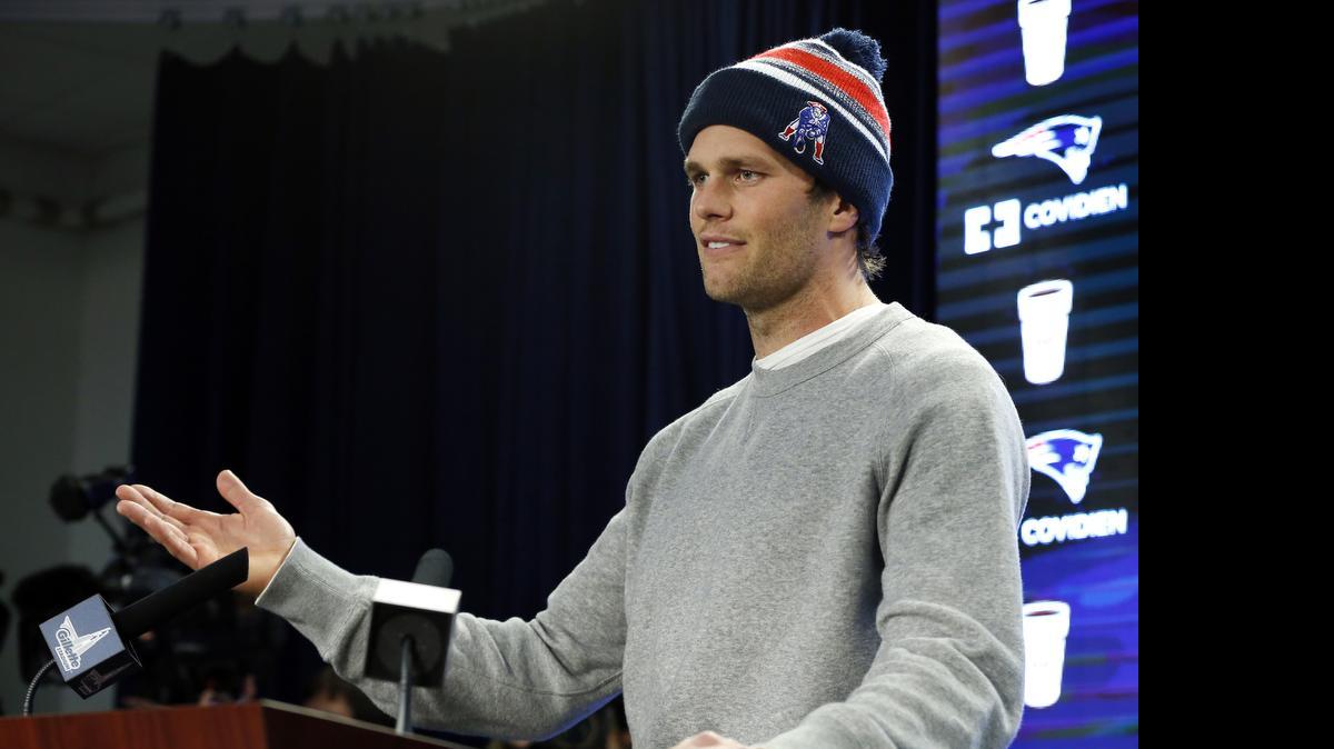 
In this Jan. 22, 2015, photo, New England Patriots quarterback Tom Brady speaks about the NFL investigation into deflated footballs, in Foxborough, Mass. An NFL investigation has found that New England Patriots employees likely deflated footballs and that quarterback Tom Brady was “at least generally aware” of the rules violations. 
