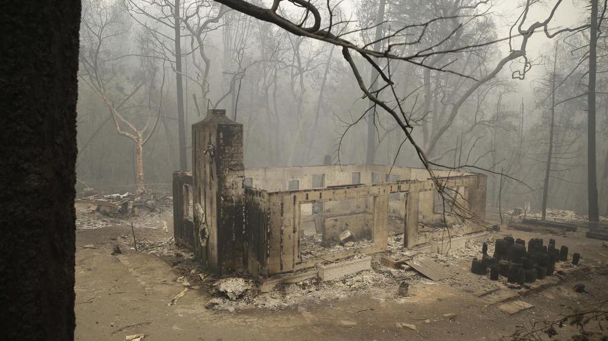 
Only the chimney and walls remain of a home destroyed by fire along Highway 175 near Middletown. 
