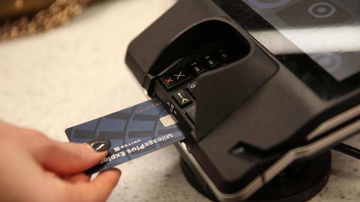 A customer pays with a chip credit card on Feb. 16, 2016 at a Target Express store in Chicago.