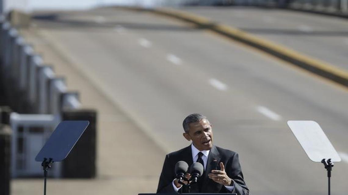 
President Barack Obama speaks near the Edmund Pettus Bridge, Saturday, March 7, 2015, in Selma, Ala. This weekend marks the 50th anniversary of "Bloody Sunday,' a civil rights march in which protestors were beaten, trampled and tear-gassed by police at the Edmund Pettus Bridge, in Selma. 
