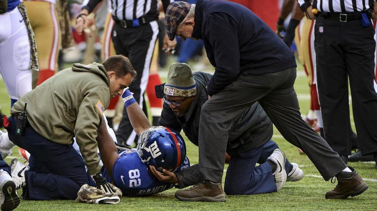 New York Giants wide receiver Rueben Randle is examined for a head injury during a game in East Rutherford, N.J., Nov. 16, 2014. Confidential data obtained by The Times shows that more than 100 diagnosed concussions were omitted from NFL studies on concussions.