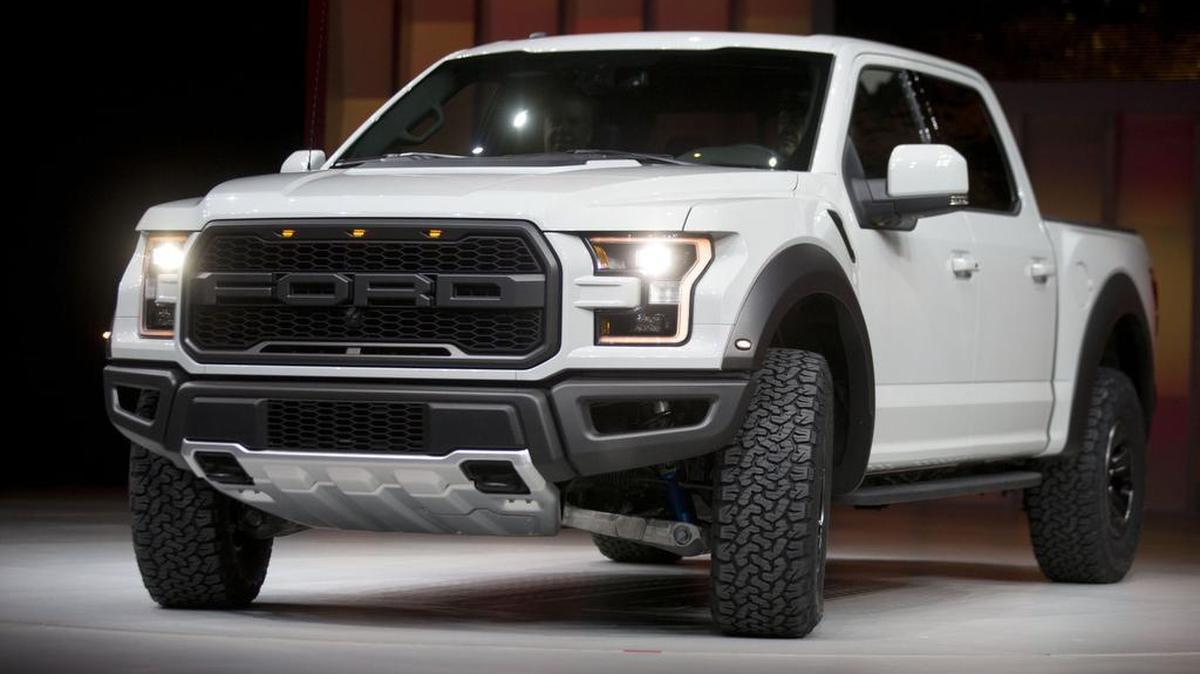 A Ford F-150 Raptor vehicle at the 2016 North American International Auto Show (NAIAS) in Detroit. Ford and other manufacturers are racing to incorporate new technologies in their pickups, including gas-electric hybrids and 10-speed transmissions.