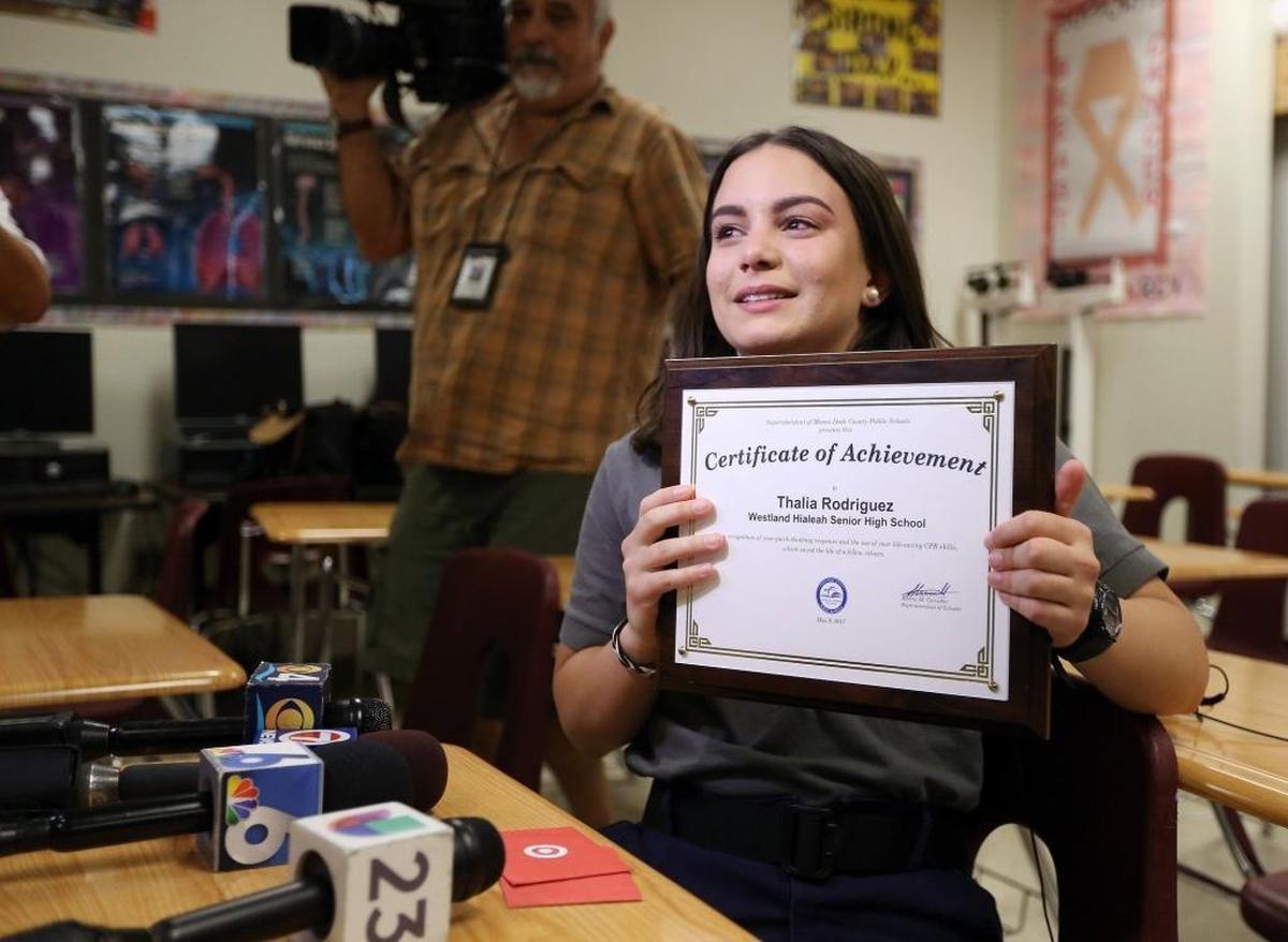 Miami, Florida, May 9, 2017- Thalia Rodriguez shows off a plaque presented to her by Miami-Dade Schools Superintendent Alberto Carvalho during a press conference at Westland Hialeah High.