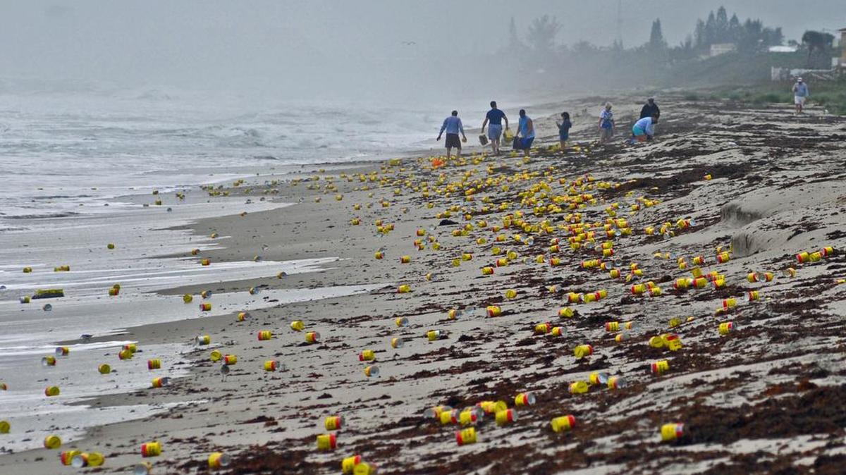 Thousands of cans and vacuum packed bricks of Cafe Bustelo brand coffee have washed up on the beaches of Indialantic, Fla., on Dec. 8, 2015, most likely from a barge container that had fallen overboard this past weekend.