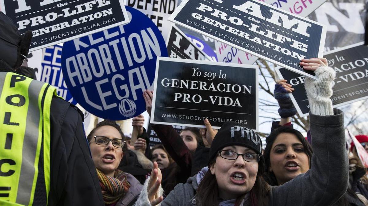 Protesters on both sides of the abortion issue outside the U.S. Supreme Court during an annual March for Life event in Washington, D.C., in January. Michigan’s attorney general has vowed to appeal a federal court ruling striking down a state law requiring physicians performing abortions to have admitting privileges at nearby hospitals to the U.S. Supreme Court.