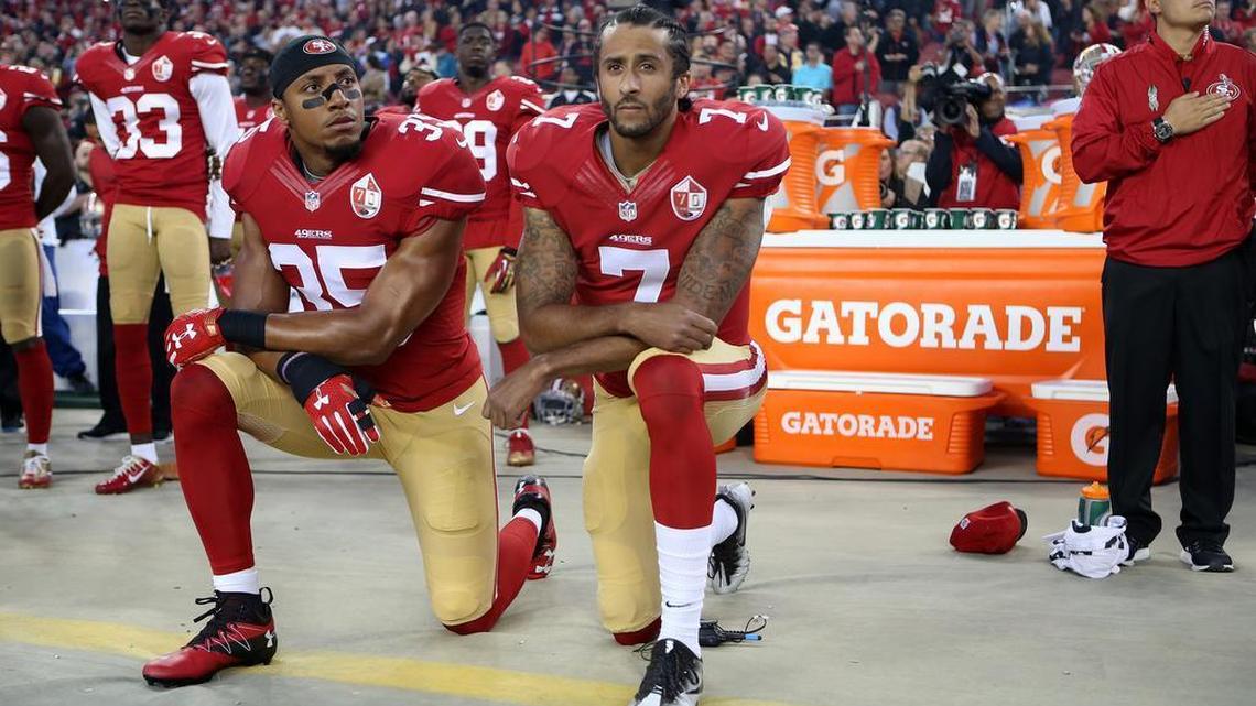 San Francisco 49ers Eric Reid (35) and Colin Kaepernick (7) take a knee during the National Anthem prior to their season opener against the Los Angeles Rams during an NFL football game Monday, Sept. 12, 2016, in Santa Clara, CA.