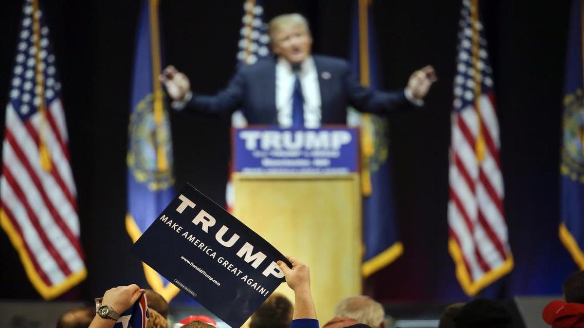 A supporter holds up a sign as Republican presidential candidate, businessman Donald Trump addresses the crowd during a campaign rally Monday, Feb. 8, 2016, in Manchester, N.H. Eric Trump, Donald Trump’s son, in an appearance this week on Fox News’s “On The Record” with Greta Van Susteren, says the highly controversial near-drowning “waterboarding” practice isn’t torture.