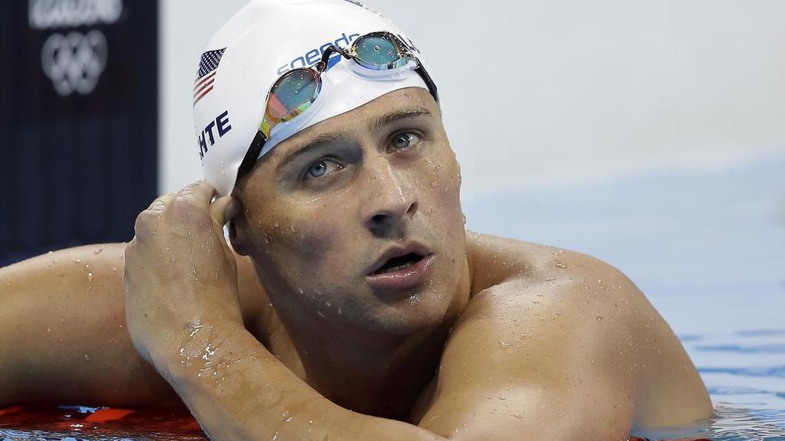 U.S. swimmer Ryan Lochte checks his time in a men’s 4x200-meter freestyle heat during the swimming competitions at the 2016 Summer Olympics, in Rio de Janeiro, Brazil. Lochte reportedly has been suspended from competition for the next 10 months after claiming he’d been held up at gunpoint in a Rio gas station.