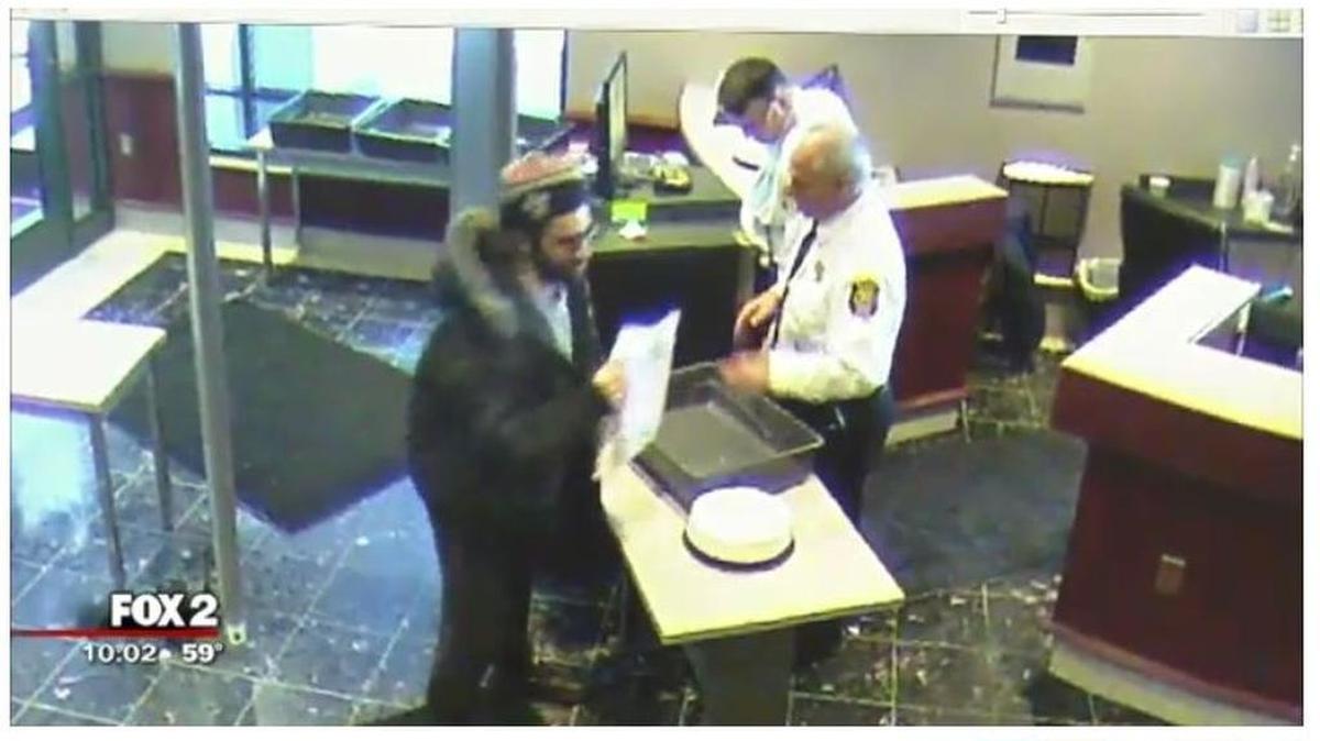 A video screen grab from WJBK shows Anthony Sevy trying to pay a $10 parking ticket with pennies, which led to an altercation and eventual lawsuit.