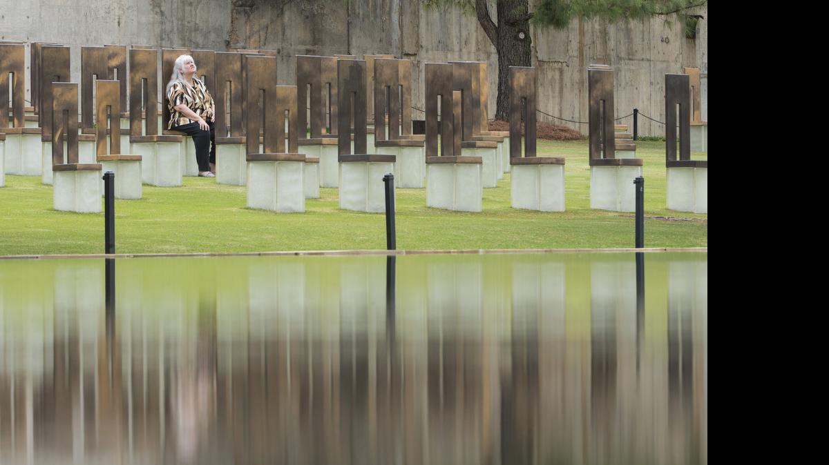 
Tina Tomlin sits in a chair that memorializes her husband Rick at the Oklahoma City National Memorial on April 16, 2015 in Oklahoma City, Okla. Rick Tomlin, a native of Kansas, was one of 168 people who died on April 19, 1995 when a truck bomb went off outside the Alfred P. Murrah Federal Building in downtown Oklahoma City. 

