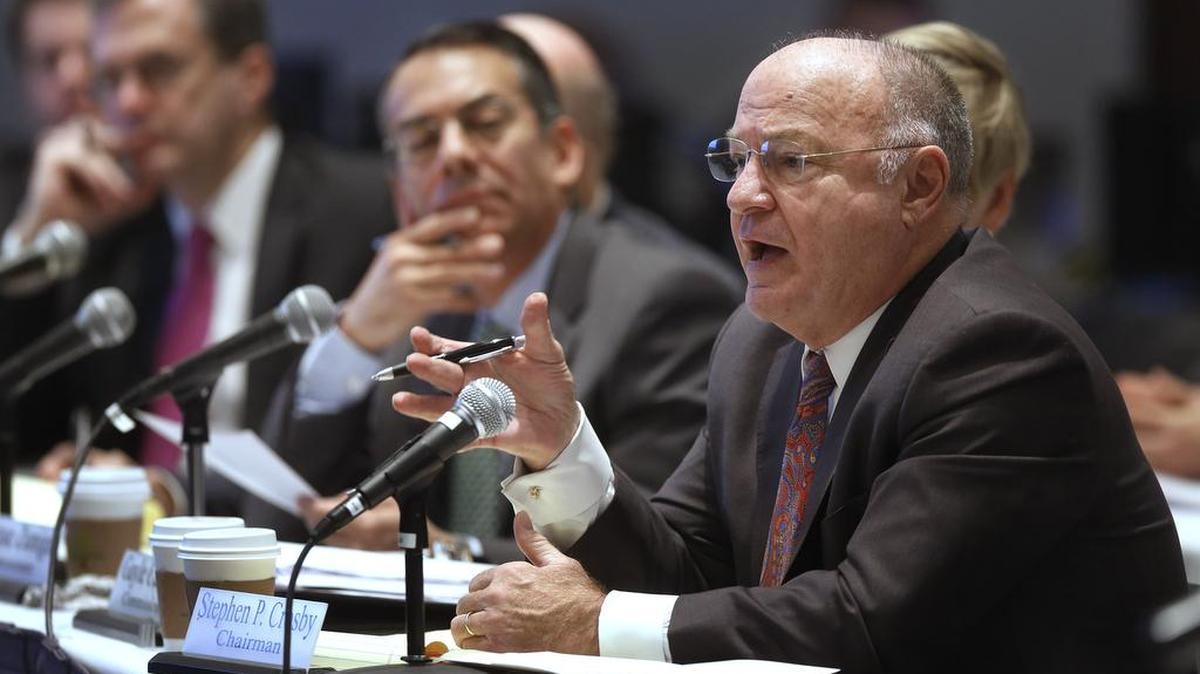 Massachusetts Gaming Commission Chairman Stephen Crosby, right, addresses a forum, Thursday, Dec. 10, 2015, in Boston. Daily fantasy sports companies DraftKings and FanDuel voiced support Thursday for Massachusetts' approach to regulating their controversial industry as states across the country weigh greater restrictions or outright bans on the games played for money.