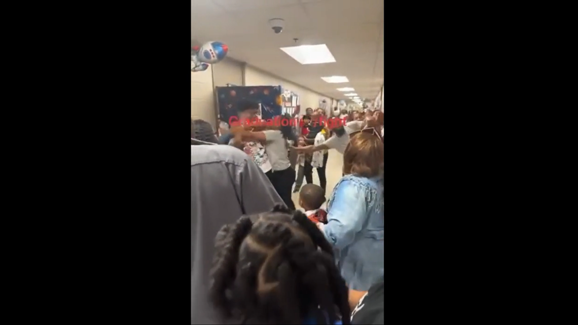 Video shows adults fight in a hallway at an Arkansas elementary school during a class graduation.