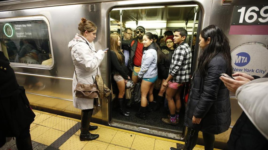 The doors of a subway train open revealing pantless riders in colorful underwear during the 15th annual No Pants Subway Ride on Sunday in New York. The group event has been going on since 2002.