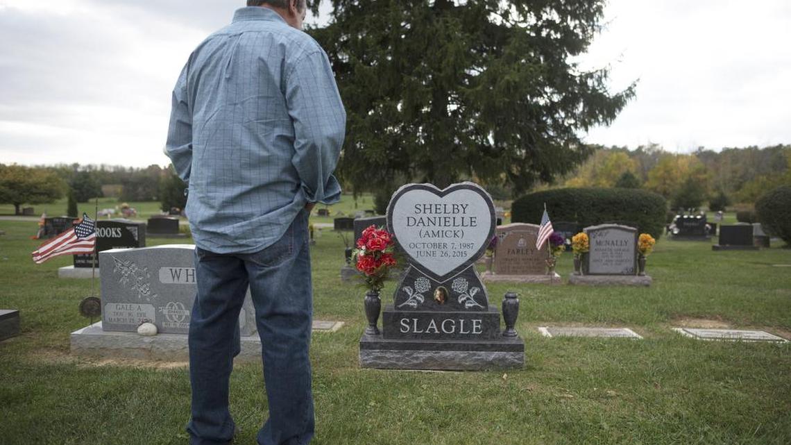 Craig Amick, 57, of Canal Winchester, Ohio, stands at the gravesite in Canal Winchester, Ohio, of his daughter, Shelby Slagle, who died, June 26, 2015, of a fungal infection at UPMC Presbyterian in Pittsburgh. Slagle, who was born with a heart defect, successfully received a heart transplant at UMPC Presbyterian but contracted a fungal infection and died 55 days later.