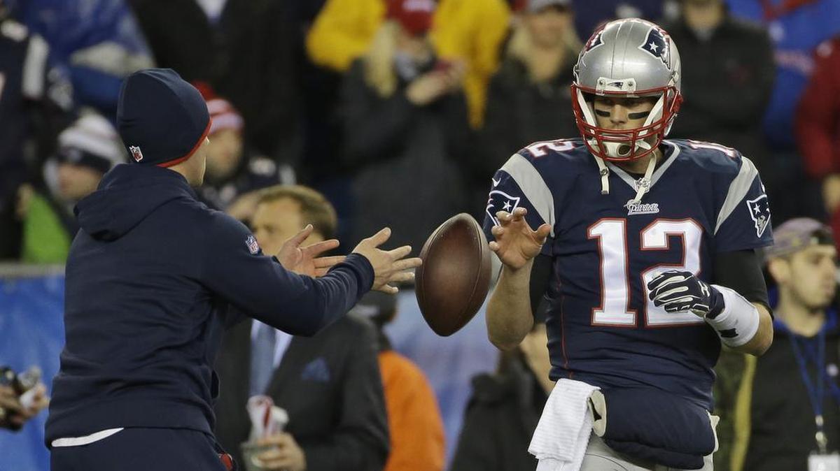 New England Patriots quarterback Tom Brady has a ball tossed to him during warmups before the AFC championship game on Jan. 18, 2015, against the Indianapolis Colts in Foxborough, Mass. A federal appeals court has ruled, Monday, April 25, 2016, that Brady must serve a four-game “Deflategate” suspension imposed by the NFL, overturning a lower judge and siding with the league in a battle with the players union.