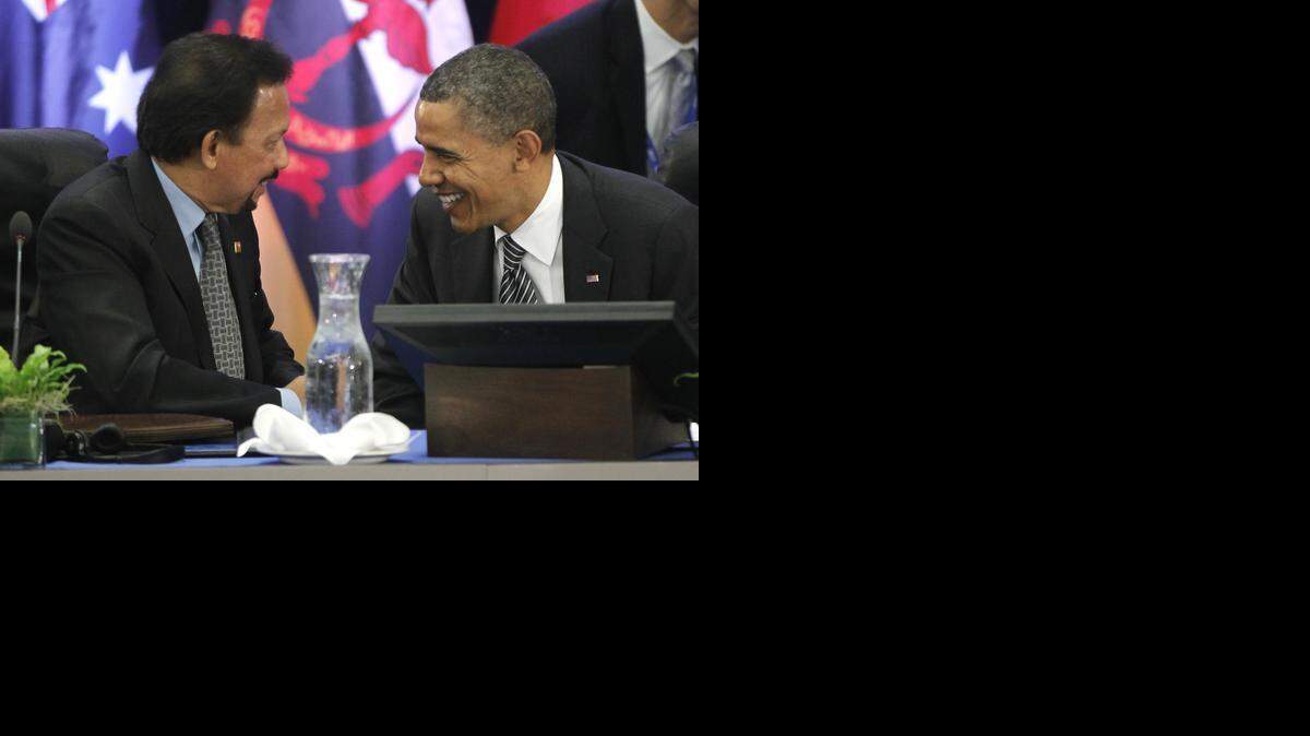 
President Barack Obama talks with Brunei Sultan Hassanal Bolkiah as he meets with Trans-Pacific Partnership leaders during the APEC summit in Honolulu, Hawaii, on Nov. 12, 2011.
