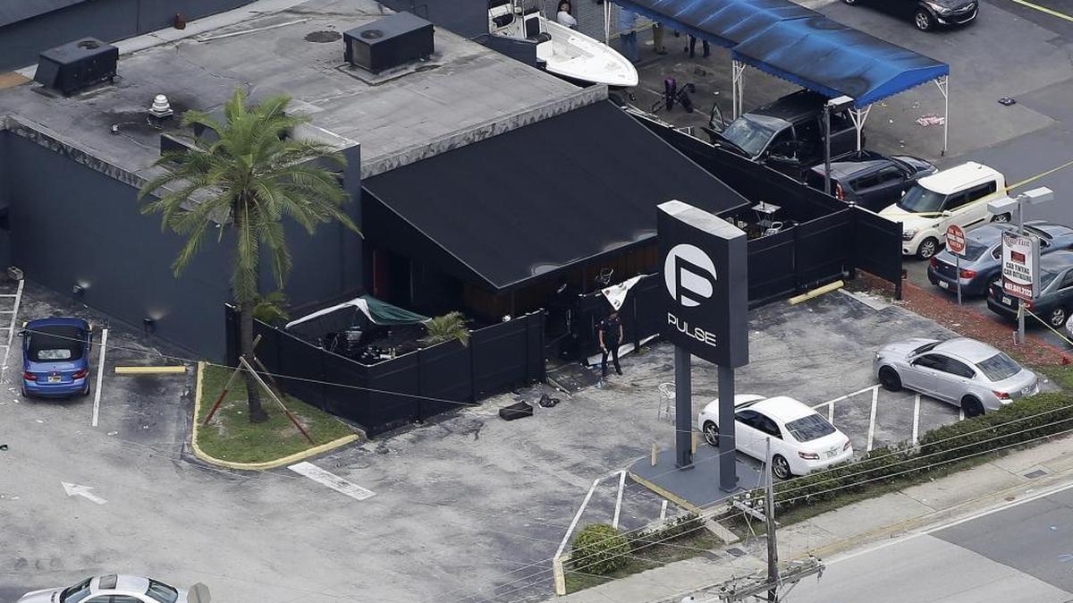 Law enforcement officials work at the Pulse Orlando nightclub following a fatal shooting Sunday, June 12, 2016, in Orlando, Fla.