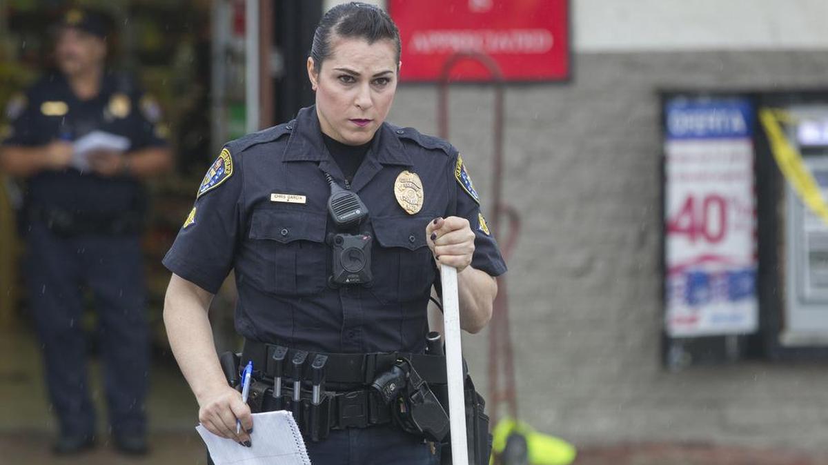 Officer Christine Garcia at the scene of a felony hit and run traffic accident in San Diego on September 21, 2016. Garcia is assigned to the traffic division. She is the first transgender officer to go public in the department.