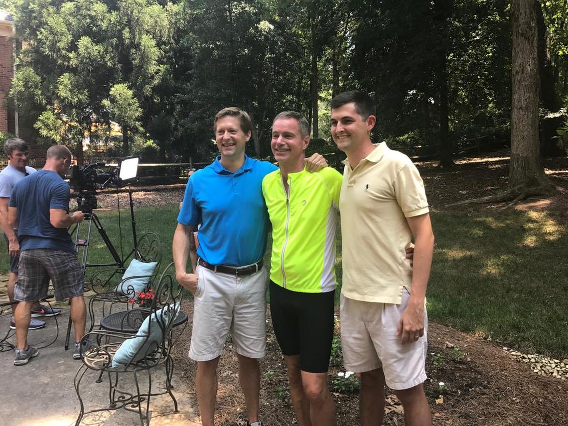 Matt McGirt, Dean Otto and Will Huffman pose for a photo in Otto’s backyard on July 22, when he hosted a group ride and fundraiser for spinal cord injury patients at Carolinas Rehabilitation. “It’s like God picked us to tell this story,” Otto says.