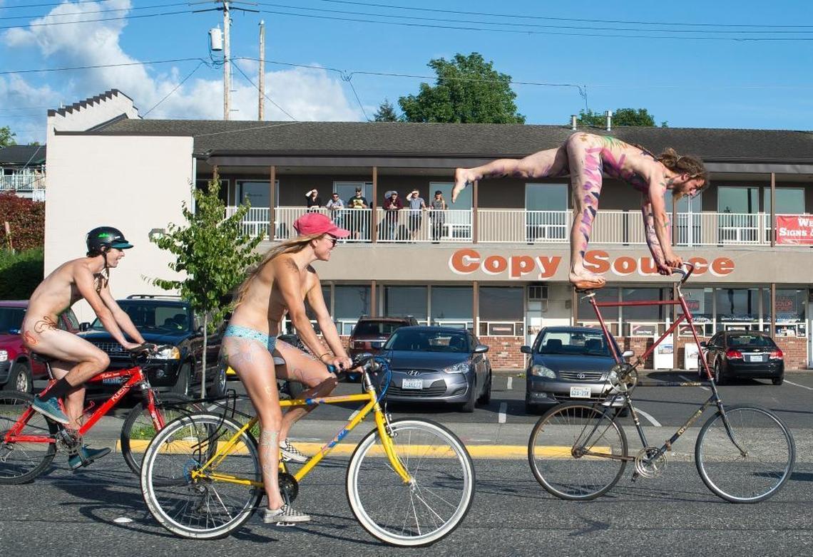 Riders in the ninth annual Bellingham World Naked Bike Ride roll down North State Street on Friday, June 2.