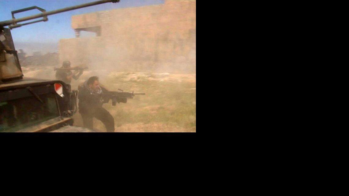 
In this still image taken from video, soldiers fire toward a target in Tikrit, Iraq on Wednesday, March 11, 2015. Only 1,000 Sunni tribesmen are taking part in the battle to recapture Tikrit, while 20,000 members of Shiite militias have converged on the city, the hometown of the late Iraqi leader Saddam Hussein, Army Gen. Martin Dempsey, chairman of the Joint Chiefs of Staff, told the Senate Foreign Relations Committee.
